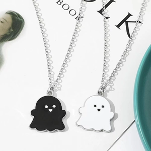Cartoon black and white ghost pendant necklaces with heart details on silver chains
