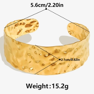 Detailed view of hammered 18k gold plated stainless steel cuff with size measurements