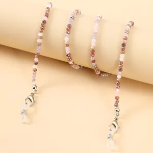 Detail of colorful faceted bead glasses chain with silver lobster clasps and silicone loops