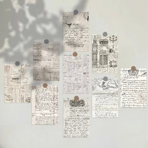Macro shot of 10 vintage postcards featuring London sketches and antique scripts on a wall