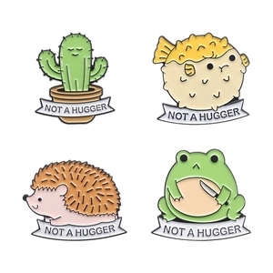 Set of 4 cute enamel animal pins featuring cactus, pufferfish, frog, and hedgehog icons