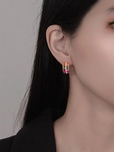 Close-up of S925 silver rainbow double-row triangle earrings on model ear
