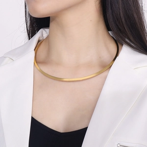 Minimalist gold flat collar necklace on model for a modern stainless steel jewelry look