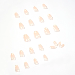 Floral almond-shaped press-on nails with white daisy patterns on a nude pink base