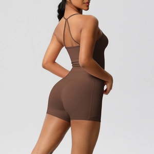 Detail of cross back yoga tank top and high waist shorts with side pocket in brown