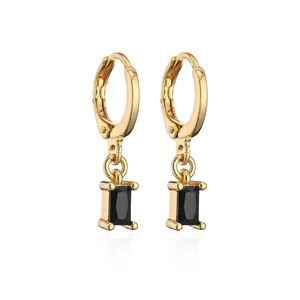 Detailed view of golden huggie hoop earrings with rectangular black zircon pendants