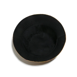 Interior view of the reversible bucket hat showing smooth black fabric and stitching