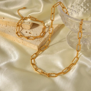 Hammered gold stainless steel necklace and bracelet set on elegant silk and stone