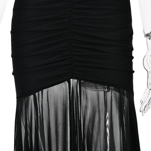 Detail showing the pleated waist design and transparent mesh fabric of this black maxi dress