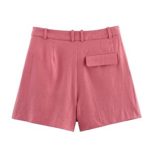 Detail view of pink linen shorts back with decorative pocket flap and belt loops