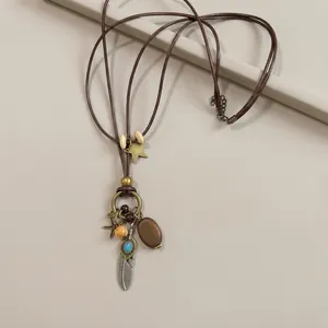 Detail shot of a bohemian tassel necklace with wooden beads and vintage charms