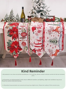 Detail of Christmas table runners with festive jacquard patterns and red fringe tassels