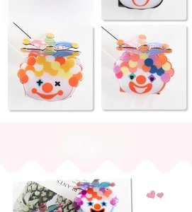 Detailed view of colorful cartoon clown PVC hair claw clip with sturdy metal spring mechanism