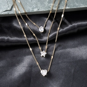 Chic layered gold necklace with teardrop, star, and heart-shaped zircon pendants