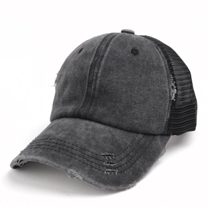 Detail of distressed dark grey washed cotton baseball cap with breathable mesh back