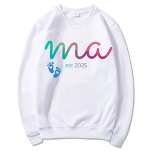 Mama Est 2025 white long sleeve hoodie with colorful art text and blue baby footprints