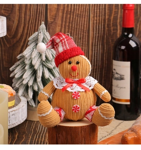 Detailed close-up of a gingerbread man plush with corduroy texture and lace collar