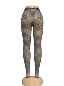 Close-up of dark grey argyle fishnet tights with intricate diamond hollow-out pattern