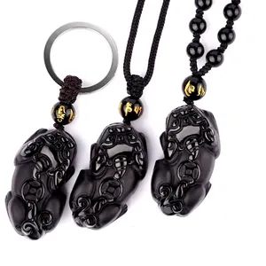 Natural obsidian Pi Xiu pendant set with necklace and keychain on white background
