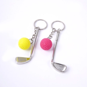Mini metal golf club and ball keychain set in pink and yellow for sports lovers