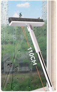 Detail showing 110cm long handle window cleaning brush scrubbing glass with water droplets