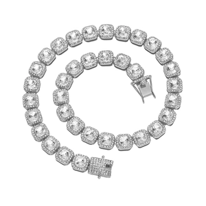 Macro shot of silver hip hop square necklace with clear crystals and a pave clasp