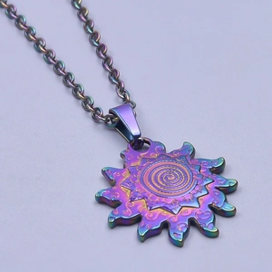Macro detail of sun pendant with spiral relief and iridescent metallic finish