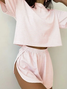 Detailed close-up of pink striped knit loungewear set with elastic waistband and soft texture
