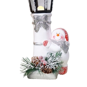 Ceramic snowman street lamp ornament with pine cone and silver bow for Christmas decor
