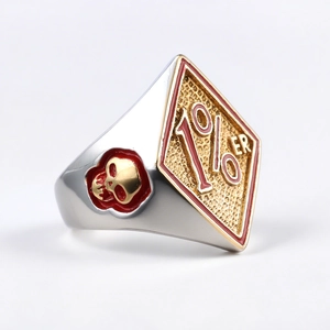 Men's biker ring in silver steel with a 1%er gold shield and skull embossing