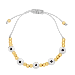 Close-up of bohemian evil eye woven bracelet with gold beads and adjustable grey cord