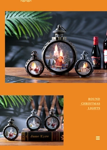 Close-up of vintage bronze LED Christmas lanterns with Santa and reindeer festive graphics