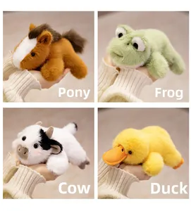 Close-up of four plush animals including pony, frog, cow and duck in a soft velvet fabric