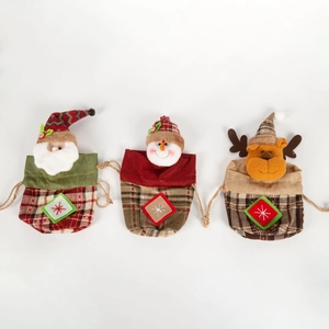 Three Christmas drawstring gift bags featuring Santa, Snowman, and Reindeer designs