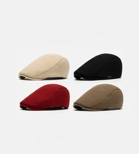 Detail of classic wool beret caps in beige, black, wine red, and coffee color options