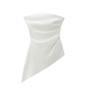 Detail of white asymmetric tube top featuring elegant side ruching and glossy fabric