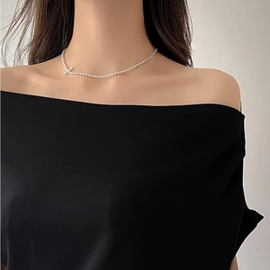 Minimalist 925 sterling silver ball chain necklace with tiny cross pendant on model