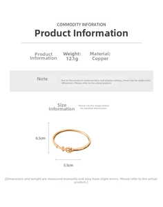 Detail of 18K gold plated arrow cross bangle with weight 12.1g and dimensions 6.5x5.5cm