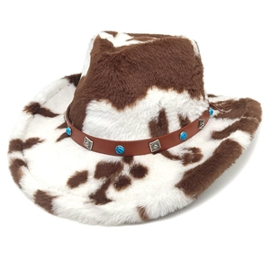 Close-up of cow print cowboy hat with brown leather band and turquoise bead details