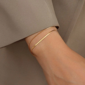 Minimalist double-layered gold snake chain bracelet in polished stainless steel