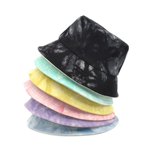 Stack of colorful tie-dye bucket hats in six various patterns for outdoor sun protection