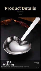 Macro shot of stainless steel heart-shaped measuring spoon with A heap of love engraving