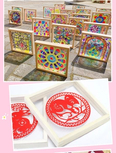 Detail view of wooden DIY frames with colorful acrylic glass and rabbit paper-cut art inserts