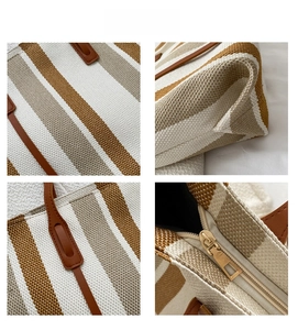 Detail of durable canvas fabric, precise leather handle stitching, and smooth metal zipper