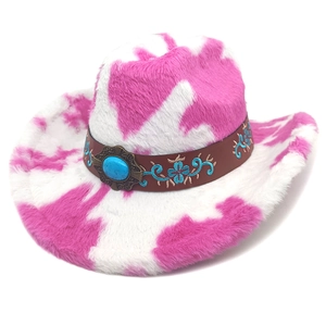 Macro view of pink cow print plush cowboy hat with turquoise stone and floral embroidery