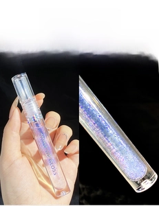 Macro shot of 01 glass candy lip gloss with blue-purple shimmer for layering