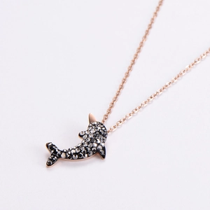 Elegant rose gold dolphin pendant necklace encrusted with black and clear crystals
