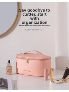 Pink cross-grain cosmetic bag on vanity table showing makeup organization function