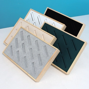 Solid wood jewelry display tray with multiple velvet slots for rings in various colors