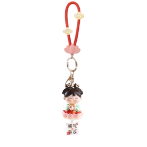 Cartoon Tang Dynasty girl keychain on pink lotus base with red lucky charm strap